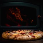 pizza on white ceramic plate